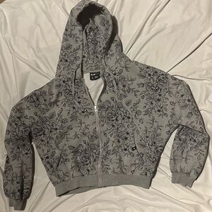 Popflex full zip hoodie size L/XL main color is grey with floral print